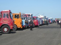 Trucks from many generations line up in the bright sunshine Trucks from many generations line up in the bright sunshine